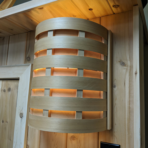 Custom cedar lighting attached to a cedar sauna.